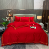 Elegant bed linen set displayed on a neatly made bed, showcasing luxurious bedroom decor.